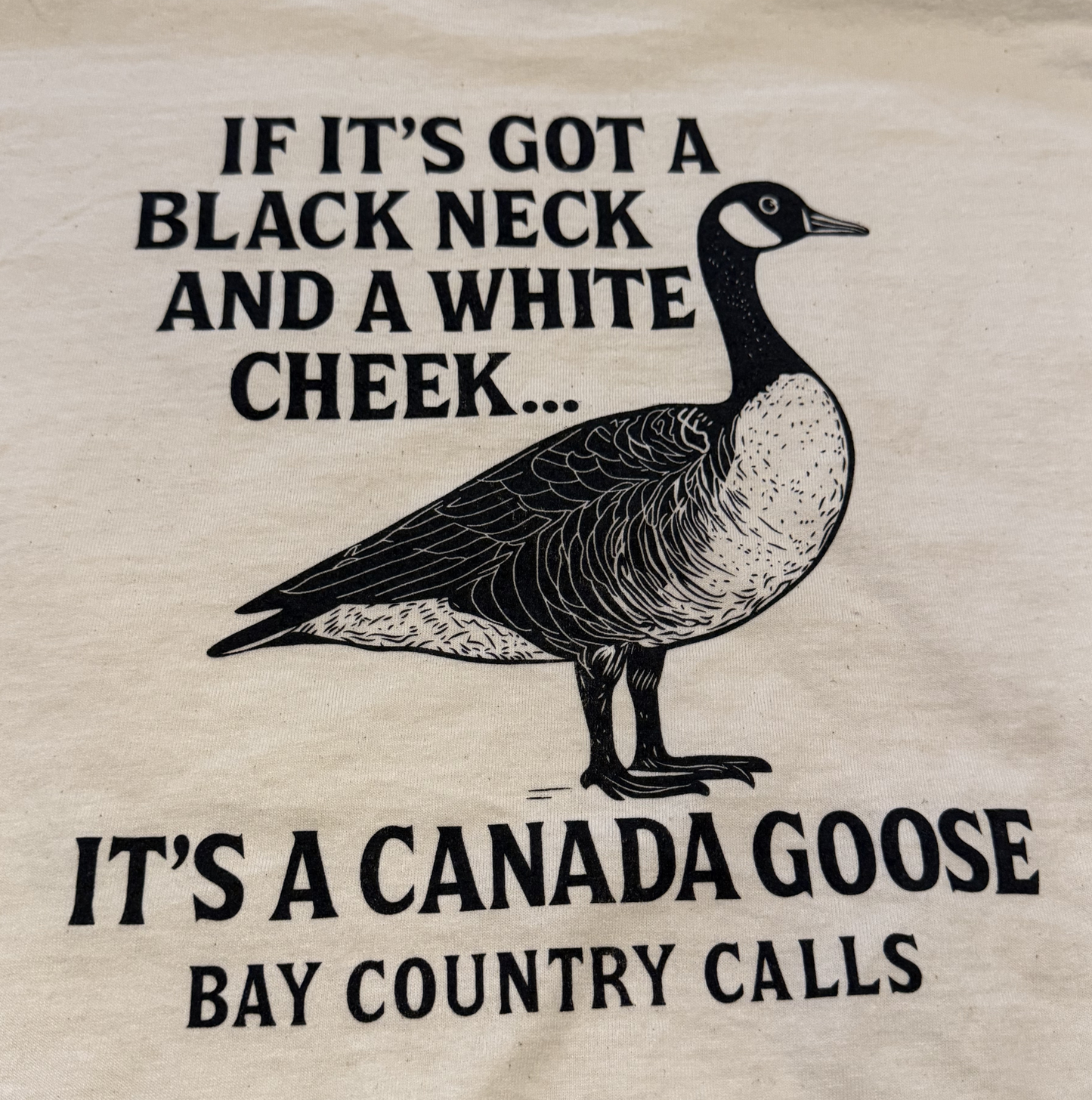 If it's got a black Neck and White Cheek Tee Shirt